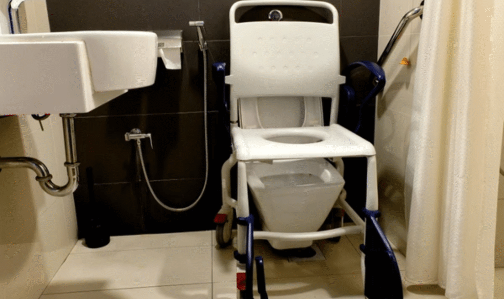 Best shower commode chair for elderly with wheels in use for home bathroom safety