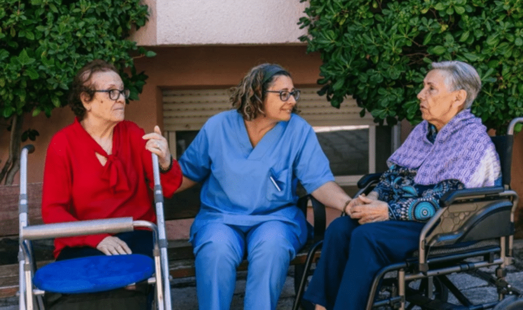 Elderly woman using home care equipment for seniors with caregiver support in living room